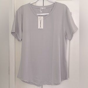 NWT COO RUN SHORT SLEEVE TOP. Silver. Size XXL. Pit to Pit 22” & neck to Hem 28”